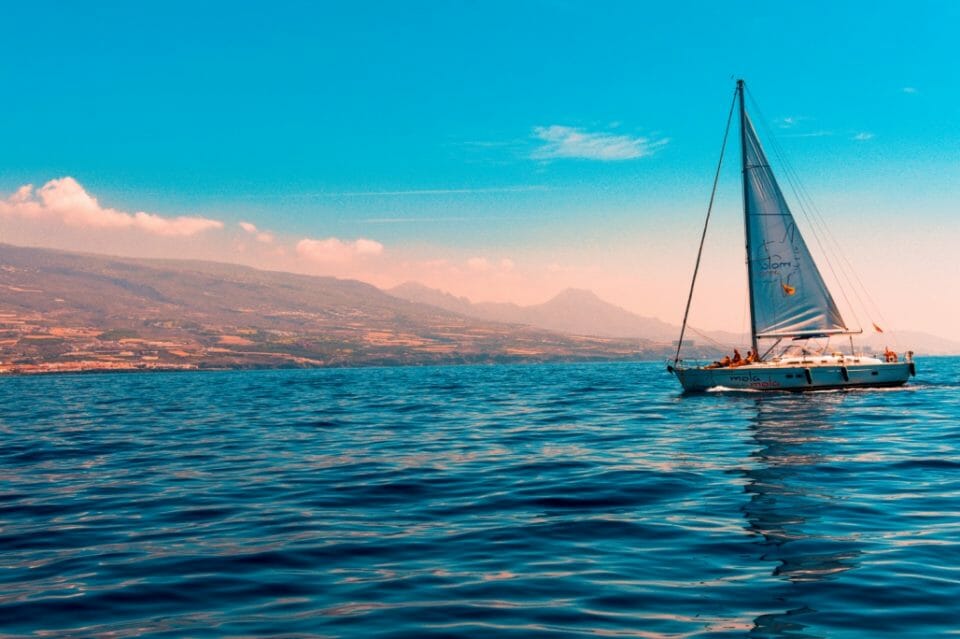 sailboat-sailing-on-water-near-island-1482193.jpg